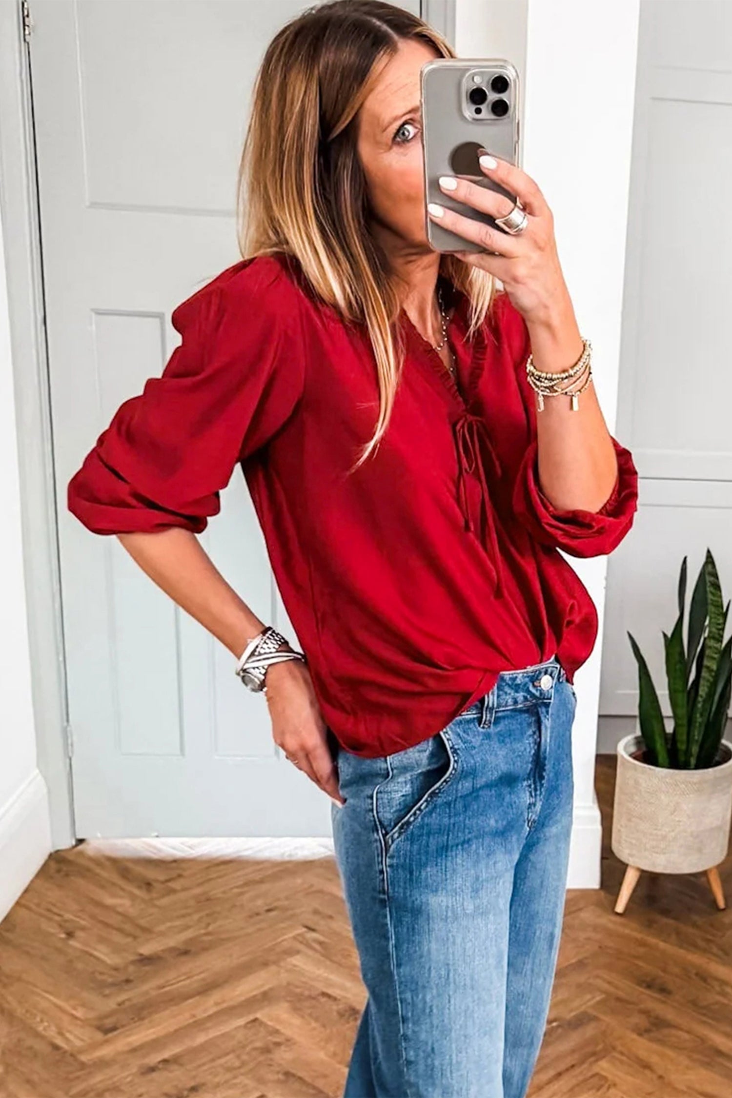 Woman in Red Frilled V-Neck Blouse taking Selfie | Pretty Melanin Boutique