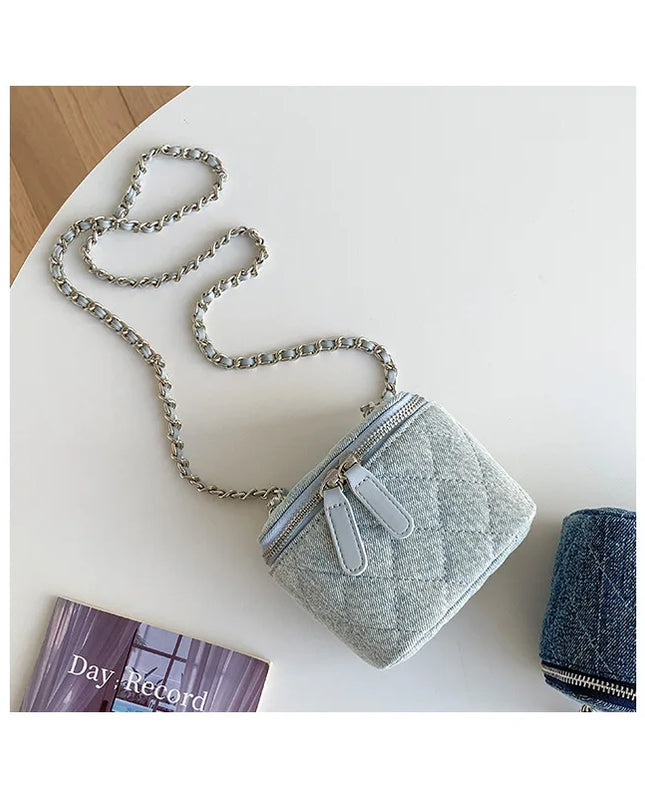 Mini light blue denim crossbody bag with Lingge quilting and silver chain strap for women.