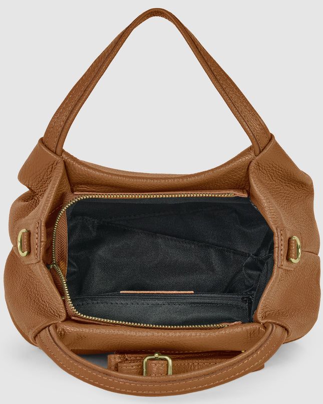 Tan Italian pebbled calfskin designer top-handle bag with gold hardware and adjustable strap.